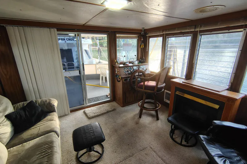 Slide: The Image of Interior of 1981 Lazy Days 50 houseboat with cozy seating and helm station. - 22