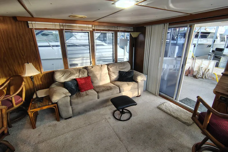 Slide: The Image of Cozy interior of 1981 Lazy Days 50 houseboat with sofa and large windows. - 27