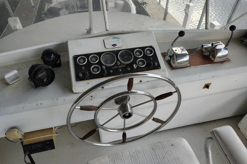 Slide: The Image of Cockpit of 1981 Lazy Days 50 boat with steering wheel and control panel. - 33