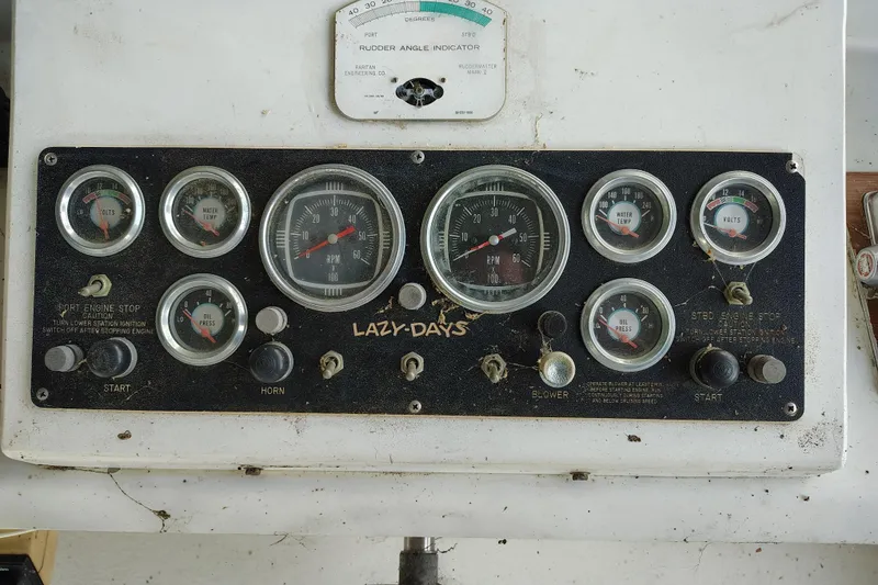 Slide: The Image of Control panel of a 1981 Lazy Days 50 boat with gauges and switches. - 34