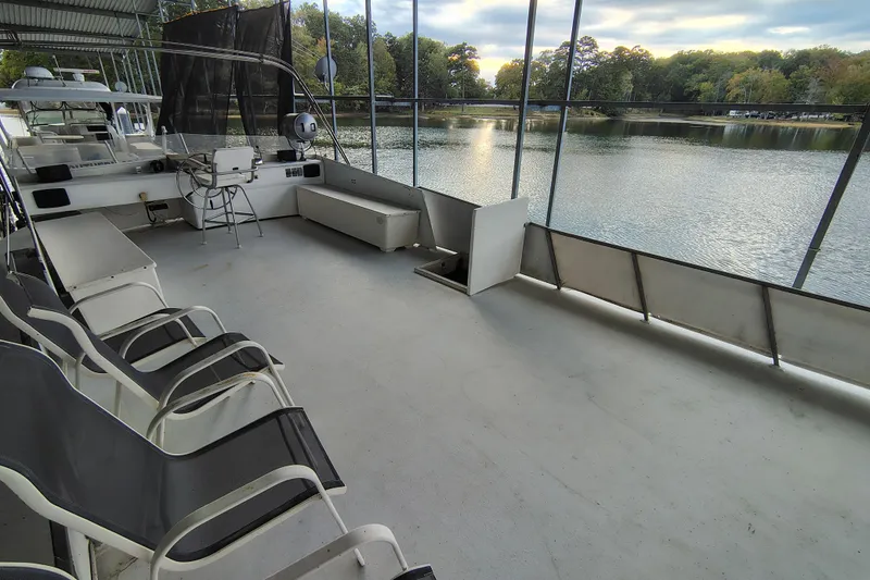 Slide: The Image of Upper deck of 1981 Lazy Days 50 houseboat with lake view and seating area. - 42