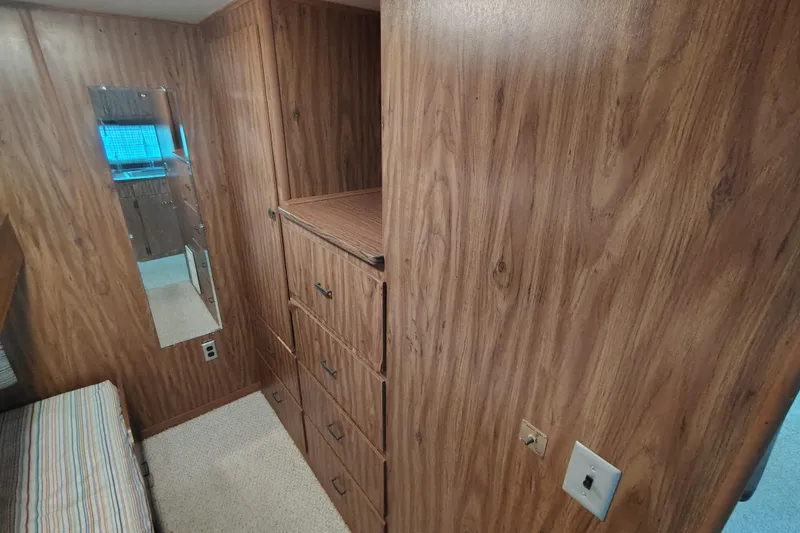 Slide: The Image of 1981 Lazy Days 50 interior with wood paneling, mirror, and built-in drawers. - 54