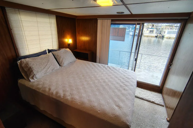Slide: The Image of Cozy bedroom in 1981 Lazy Days 50 houseboat with waterfront view. - 56