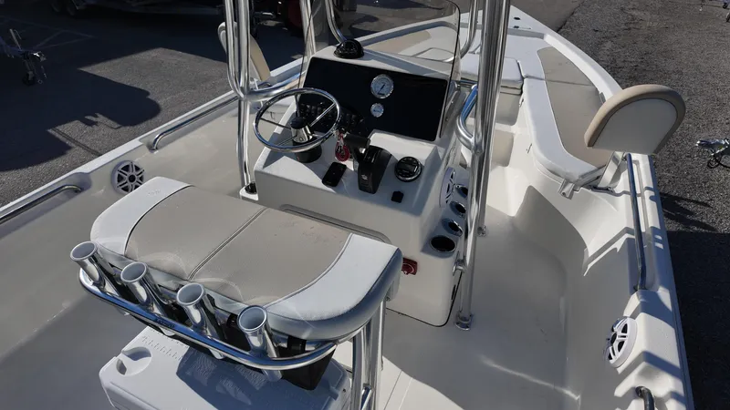 Slide: The Image of 2025 Bulls Bay 2200XS boat interior with steering console and seating. - 14