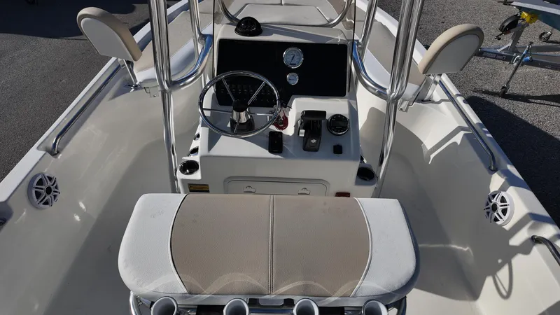 Slide: The Image of 2025 Bulls Bay 2200XS boat interior with steering console and seating. - 15