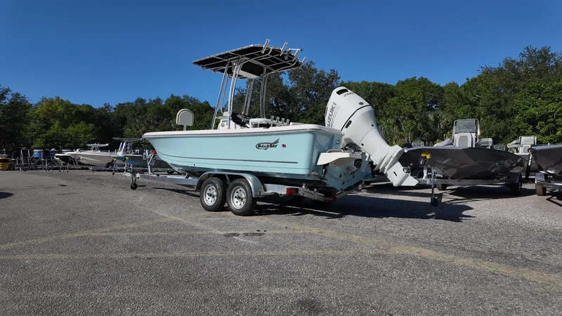 Slide: The Image of 2025 Bulls Bay 2200XS boat on trailer in parking lot, clear sky background. - 4