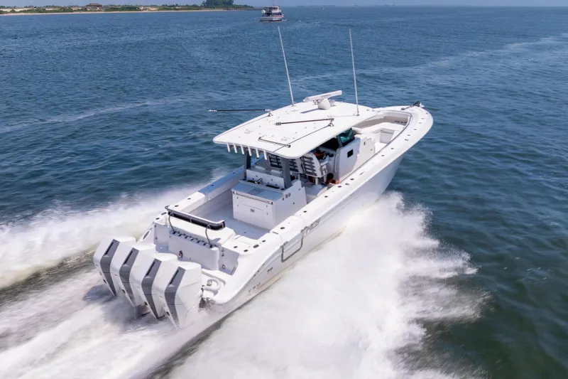 The Image of 2026 HCB 42 Lujo boat cruising on open water under a clear sky. - 0