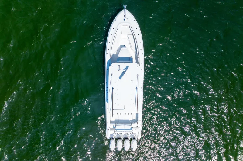 Slide: The Image of Aerial view of 2026 HCB 42 Lujo boat on green water. - 10