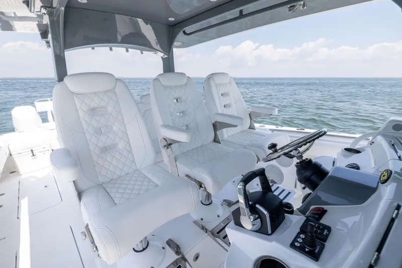 Slide: The Image of Luxurious interior of 2026 HCB 42 Lujo boat with plush seating and modern controls. - 14