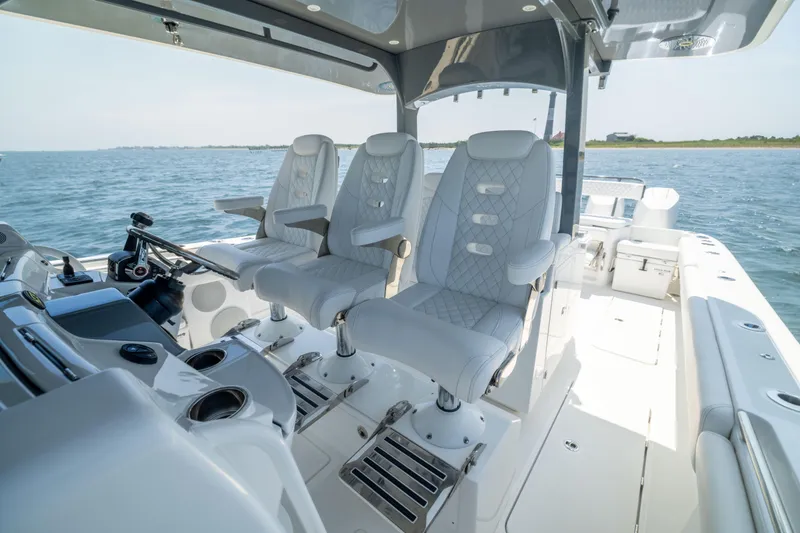 Slide: The Image of Luxurious interior of 2026 HCB 42 Lujo boat with plush seating and modern controls. - 18