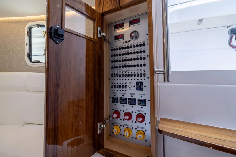 Slide: The Image of Electrical panel inside 2026 HCB 42 Lujo boat, featuring controls and gauges. - 20