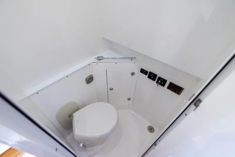 Slide: The Image of Luxury bathroom interior of 2026 HCB 42 Lujo boat, featuring modern fixtures and controls. - 22