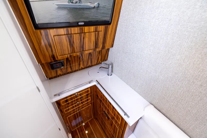 Slide: The Image of Luxurious interior of 2026 HCB 42 Lujo boat with wood finish and modern amenities. - 23