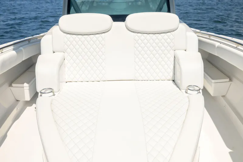 Slide: The Image of Luxurious seating on 2026 HCB 42 Lujo boat with quilted white upholstery. - 26