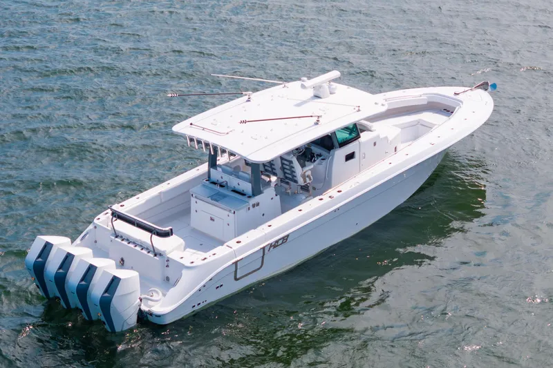 Slide: The Image of 2026 HCB 42 Lujo boat on open water, featuring sleek design and powerful engines. - 3