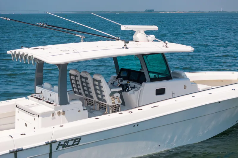 Slide: The Image of 2026 HCB 42 Lujo boat on water, featuring sleek design and modern amenities. - 7