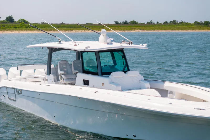Slide: The Image of 2026 HCB 42 Lujo boat cruising on open water, featuring sleek design and modern amenities. - 8