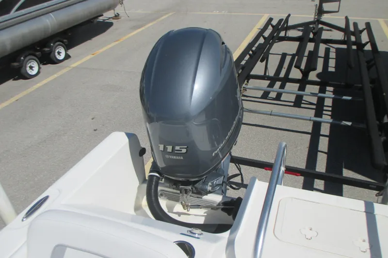 Slide: The Image of 2016 Carolina Cat 230 DC with Yamaha 115 outboard motor in parking lot. - 10