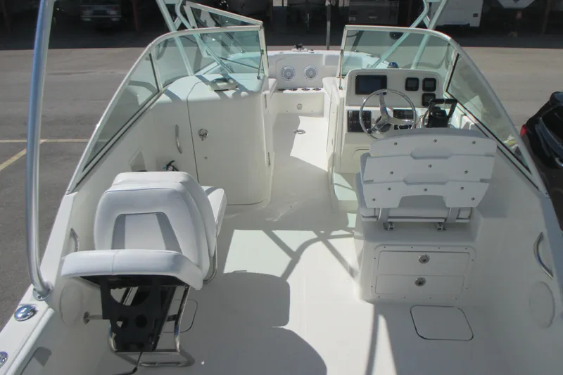 Slide: The Image of 2016 Carolina Cat 230 DC boat interior with dual consoles and seating. - 13