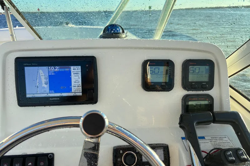 Slide: The Image of Helm of 2016 Carolina Cat 230 DC with Garmin GPS and tachometers. - 16