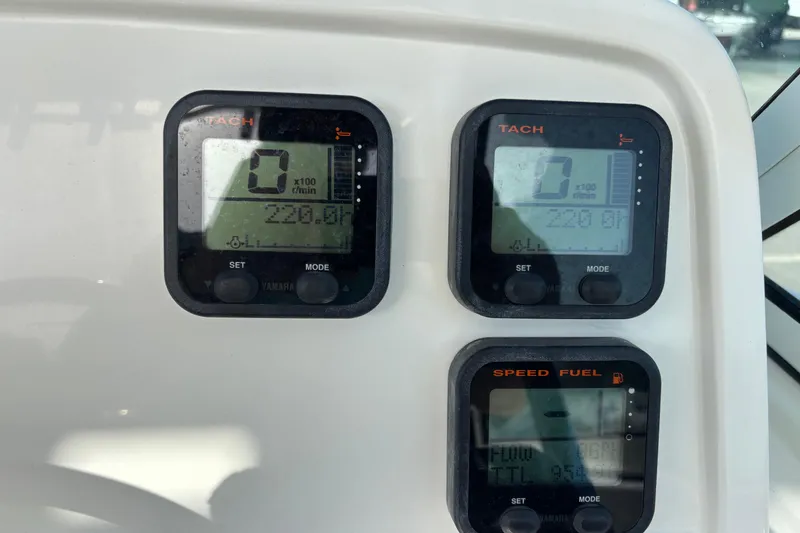 Slide: The Image of Dashboard of 2016 Carolina Cat 230 DC with tachometer and speed fuel gauges. - 17