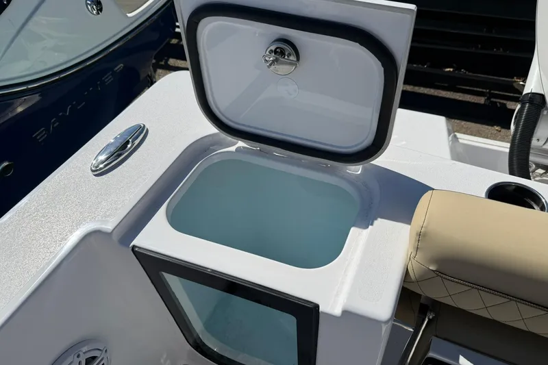 Slide: The Image of 2026 Sportsman Open 232 Center Console boat with open storage compartment. - 12