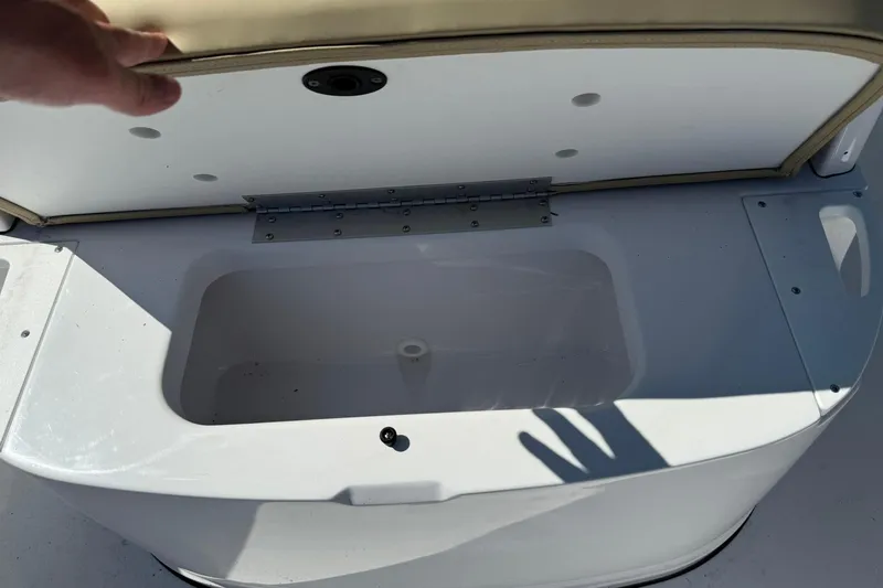 Slide: The Image of Sportsman Open 232 Center Console 2026, open storage compartment. - 17