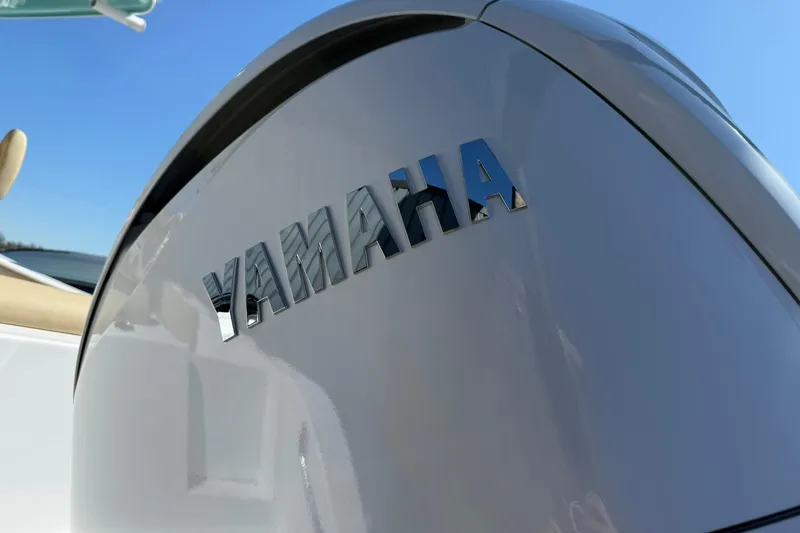 Slide: The Image of 2026 Sportsman Open 232 Center Console with Yamaha engine, close-up view. - 19