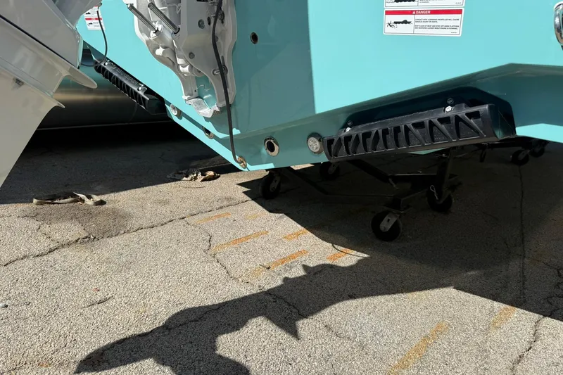 Slide: The Image of 2026 Sportsman Open 232 Center Console boat on a trailer, showing hull details. - 21