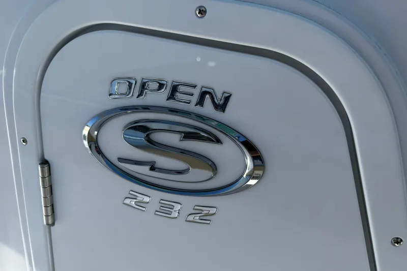 Slide: The Image of 2026 Sportsman Open 232 Center Console emblem on boat surface. - 22