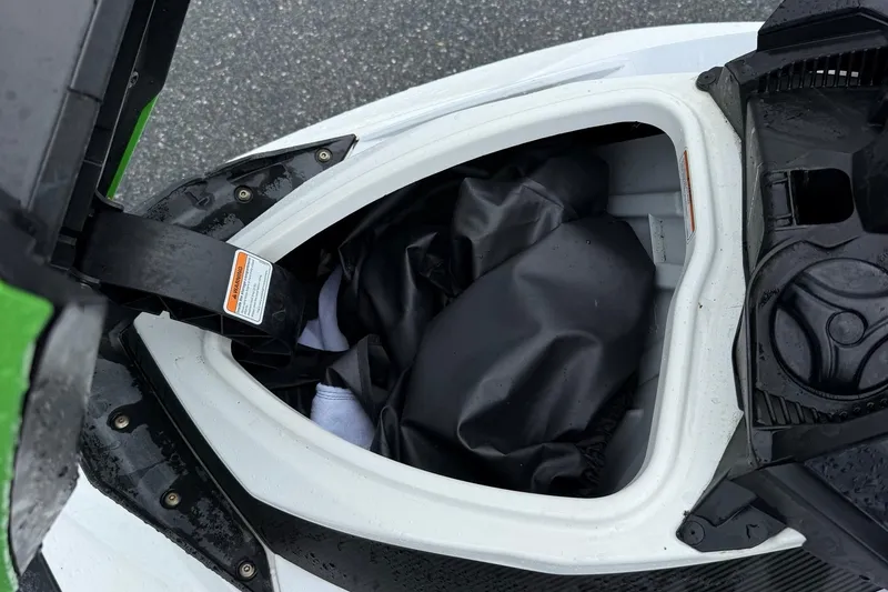 Slide: The Image of Open storage compartment of a 2013 Sea-Doo GTI 130 watercraft. - 10