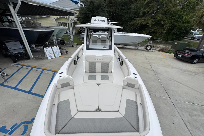 Slide: The Image of 2026 Solace 28 HCS boat with Garmin equipment, docked in a marina setting. - 19