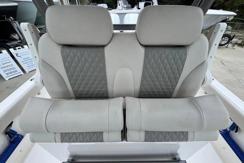 Slide: The Image of 2026 Solace 28 HCS boat seat with gray and white cushioned design. - 28