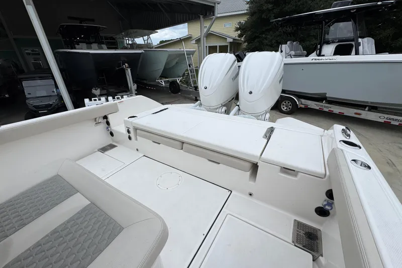 Slide: The Image of 2026 Solace 28 HCS boat with dual outboard engines in a marina setting. - 38