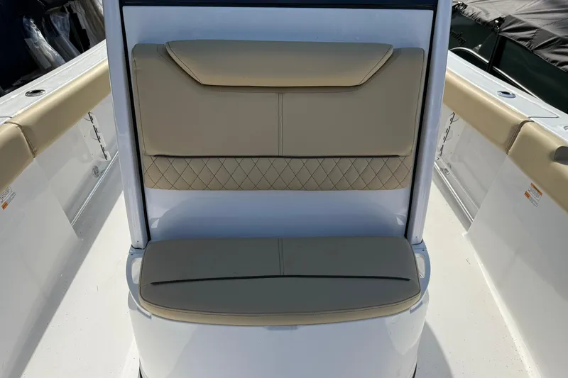 Slide: The Image of 2026 Sportsman Heritage 231 Center Console boat seating with beige cushions and diamond stitching. - 10