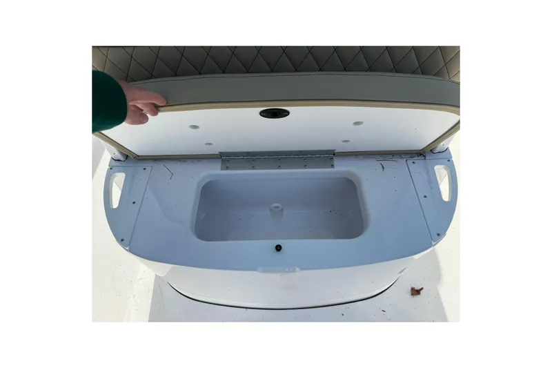 Slide: The Image of 2026 Sportsman Heritage 231 Center Console storage compartment with open lid. - 11