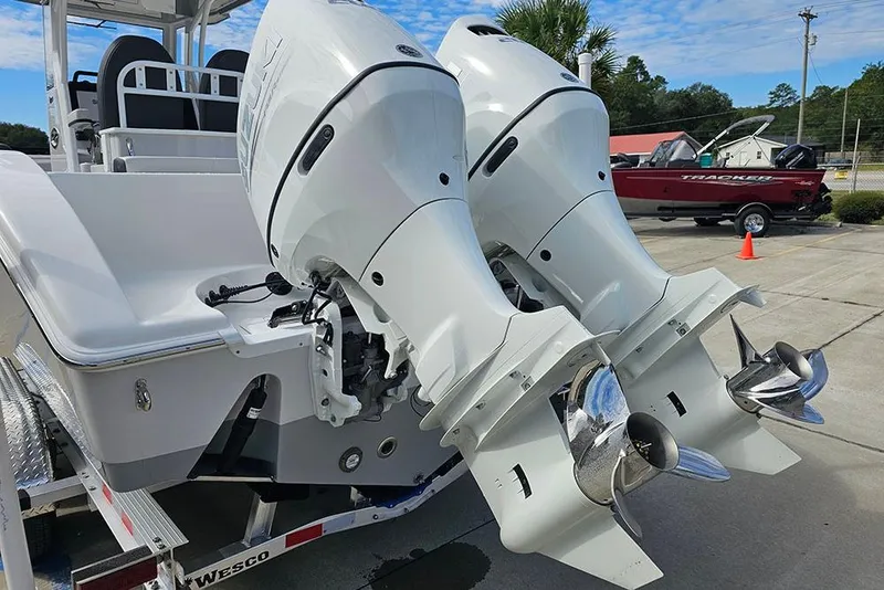 Slide: The Image of 2026 Sea Pro 262 Offshore boat with dual outboard engines on a trailer. - 10