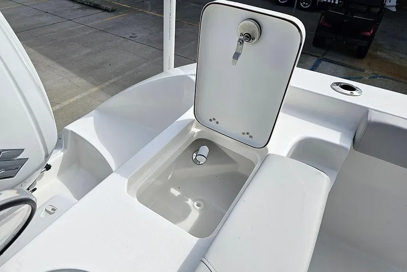 Slide: The Image of 2026 Sea Pro 262 Offshore boat deck with open storage compartment. - 13