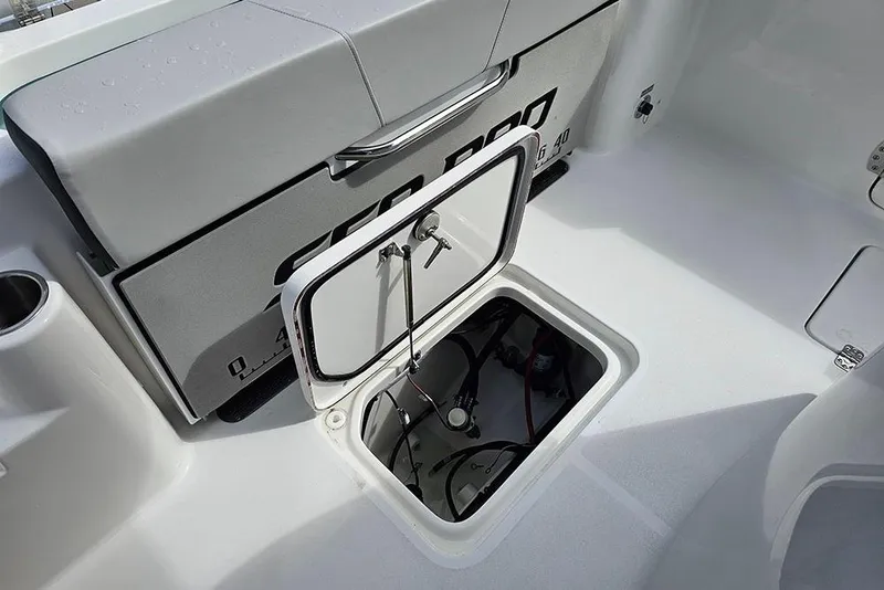 Slide: The Image of 2026 Sea Pro 262 Offshore boat with open storage compartment on deck. - 15