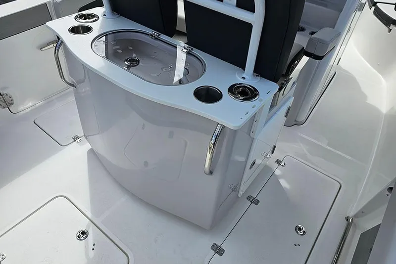 Slide: The Image of 2026 Sea Pro 262 Offshore boat interior with seating and storage features. - 16