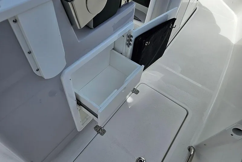 Slide: The Image of 2026 Sea Pro 262 Offshore boat interior with open storage compartment. - 19
