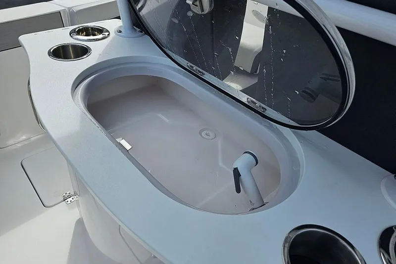 Slide: The Image of Livewell on 2026 Sea Pro 262 Offshore boat, featuring cup holders and sleek design. - 21