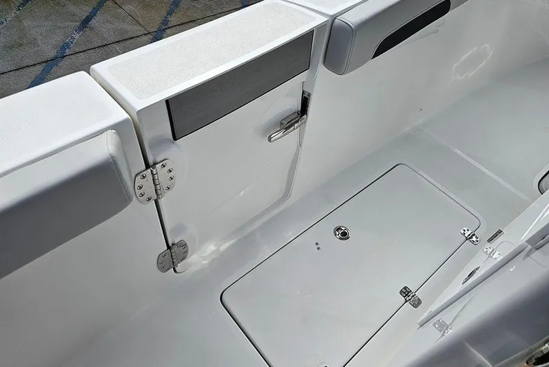 Slide: The Image of 2026 Sea Pro 262 Offshore boat interior, featuring sleek white deck and storage compartment. - 22