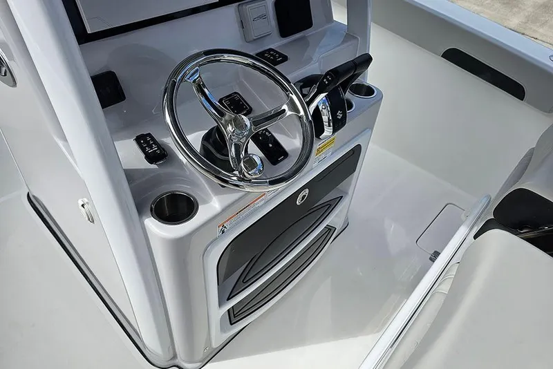 Slide: The Image of 2026 Sea Pro 262 Offshore boat helm with steering wheel and controls. - 29