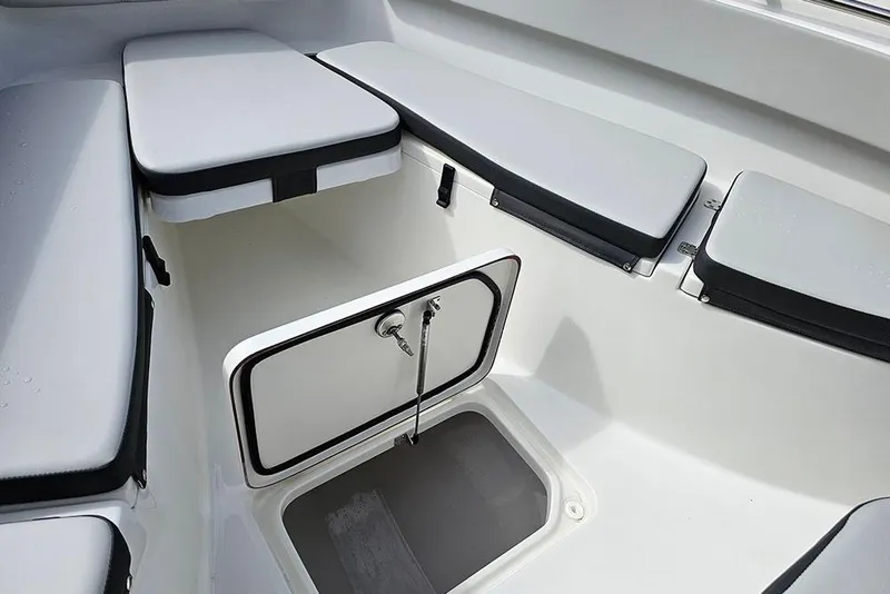 Slide: The Image of 2026 Sea Pro 262 Offshore boat interior with open storage compartment. - 36