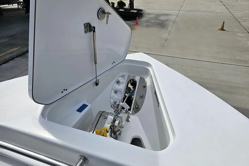 Slide: The Image of Open anchor compartment on 2026 Sea Pro 262 Offshore boat, showcasing storage and hardware. - 40