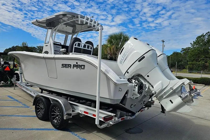 Slide: The Image of 2026 Sea Pro 262 Offshore boat on trailer with Suzuki outboard motor. - 8