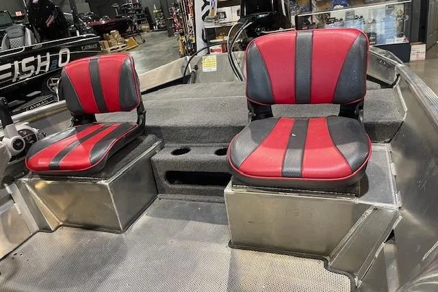 Slide: The Image of Red and black seats in a 2025 Blazer SS 17' boat interior. - 2