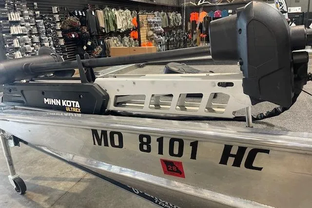 Slide: The Image of Minn Kota Ultrex motor on Blazer SS 17' boat, 2025 model, in a store setting. - 3