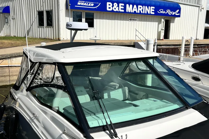 Slide: The Image of 2025 Sea Ray Sundancer 320 Outboard docked at B&E Marine dealership. - 7